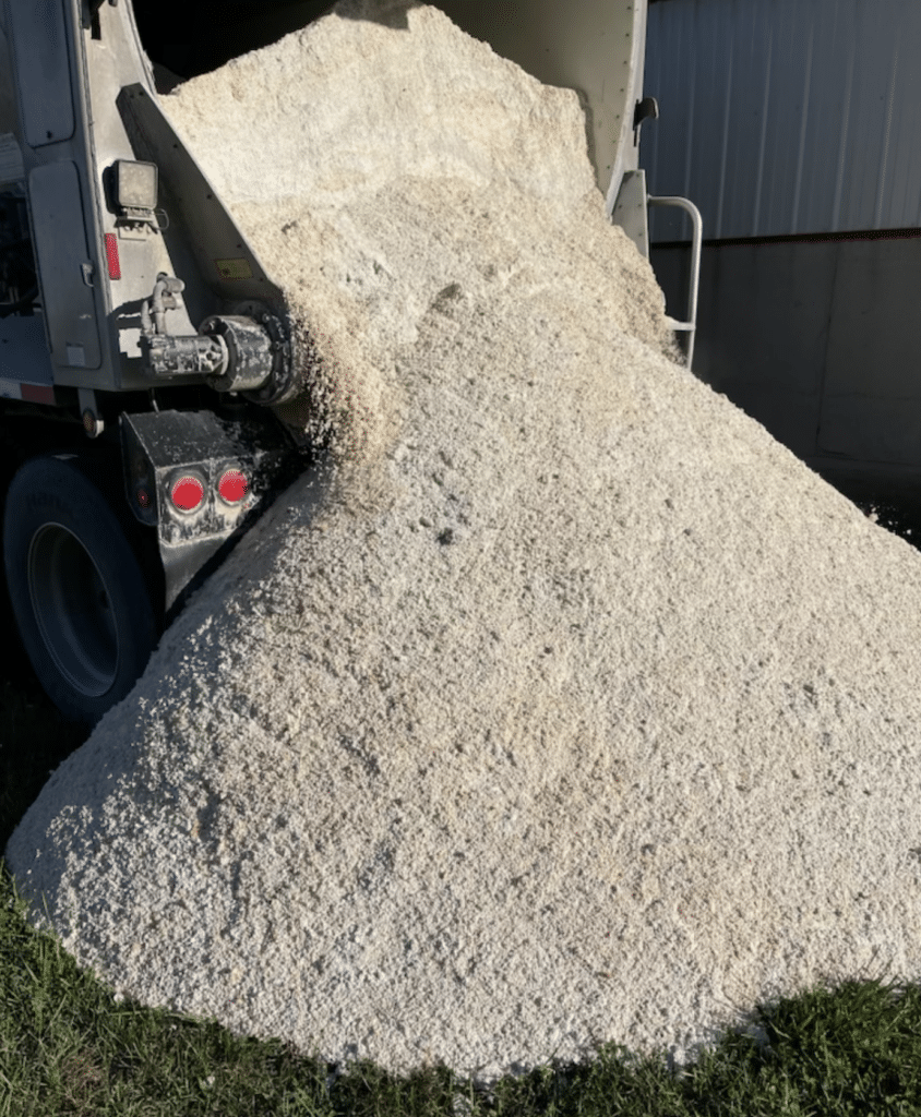 High Calcium Ag Lime material made from egg shells lowers soil ph. In the process of being dumped on field prior to spreading